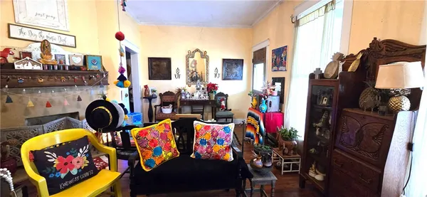 a view of a dining room with furniture and chandelier