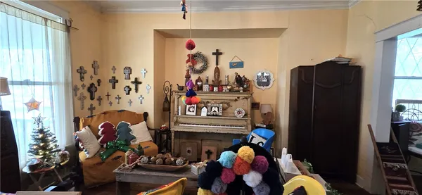 a very nice looking room with many windows and furniture