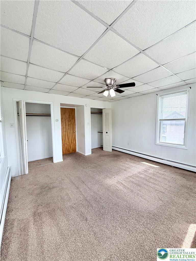 5540 Main Street Whitehall, PA 18052 - Photo 28 of 53 A well-lit bedroom features plush carpeting and convenient closet space.