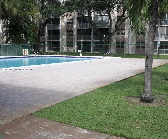 a view of a house with a yard and plants