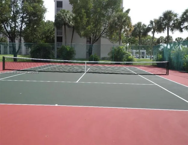 a view of outdoor space and tennis court