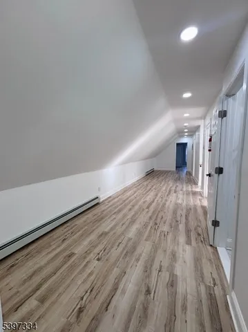 a view of gallery with wooden floor