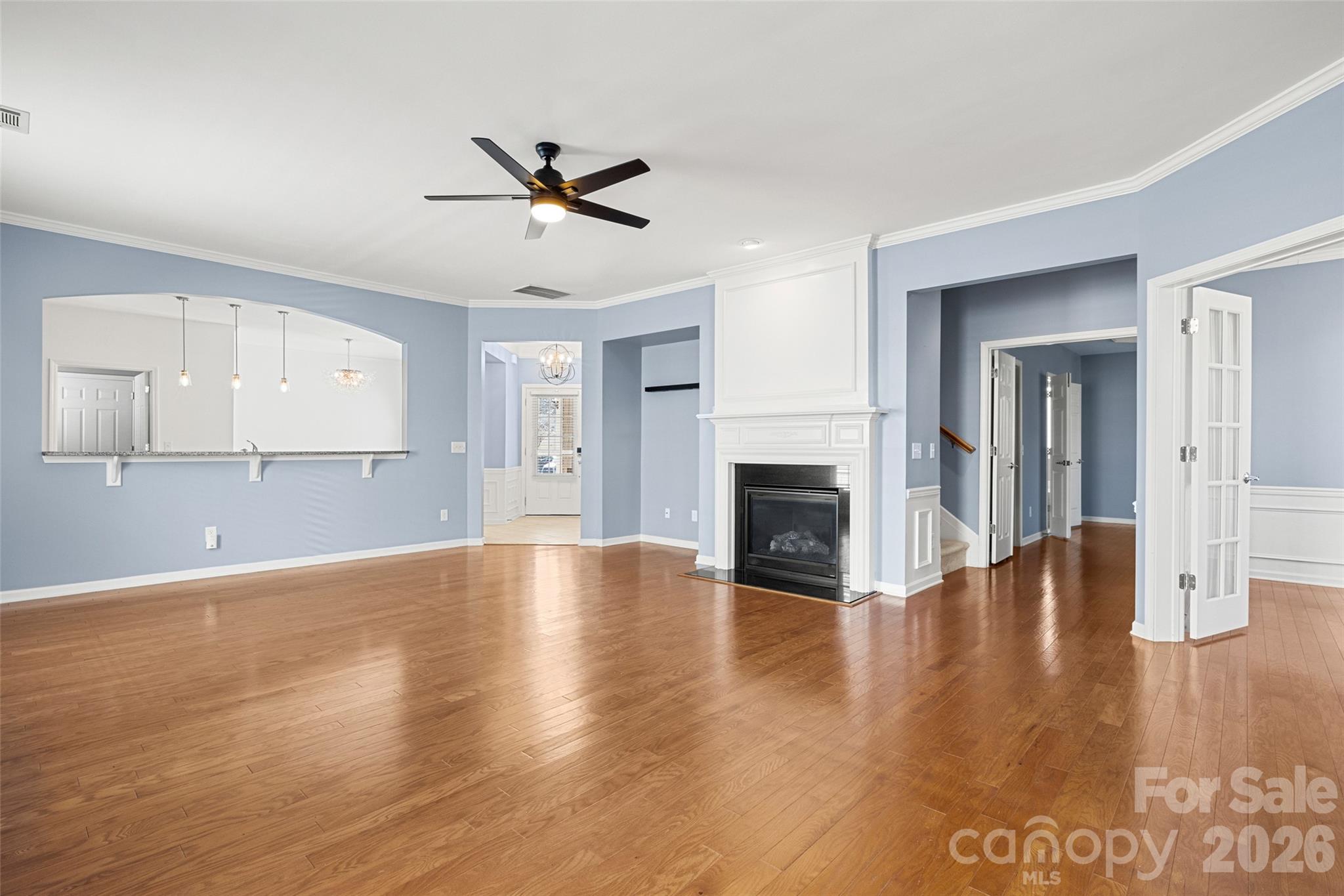 52538 Winchester Street Fort Mill, SC 29707 - Photo 11 of 48 a view of empty room with wooden floor and fireplace