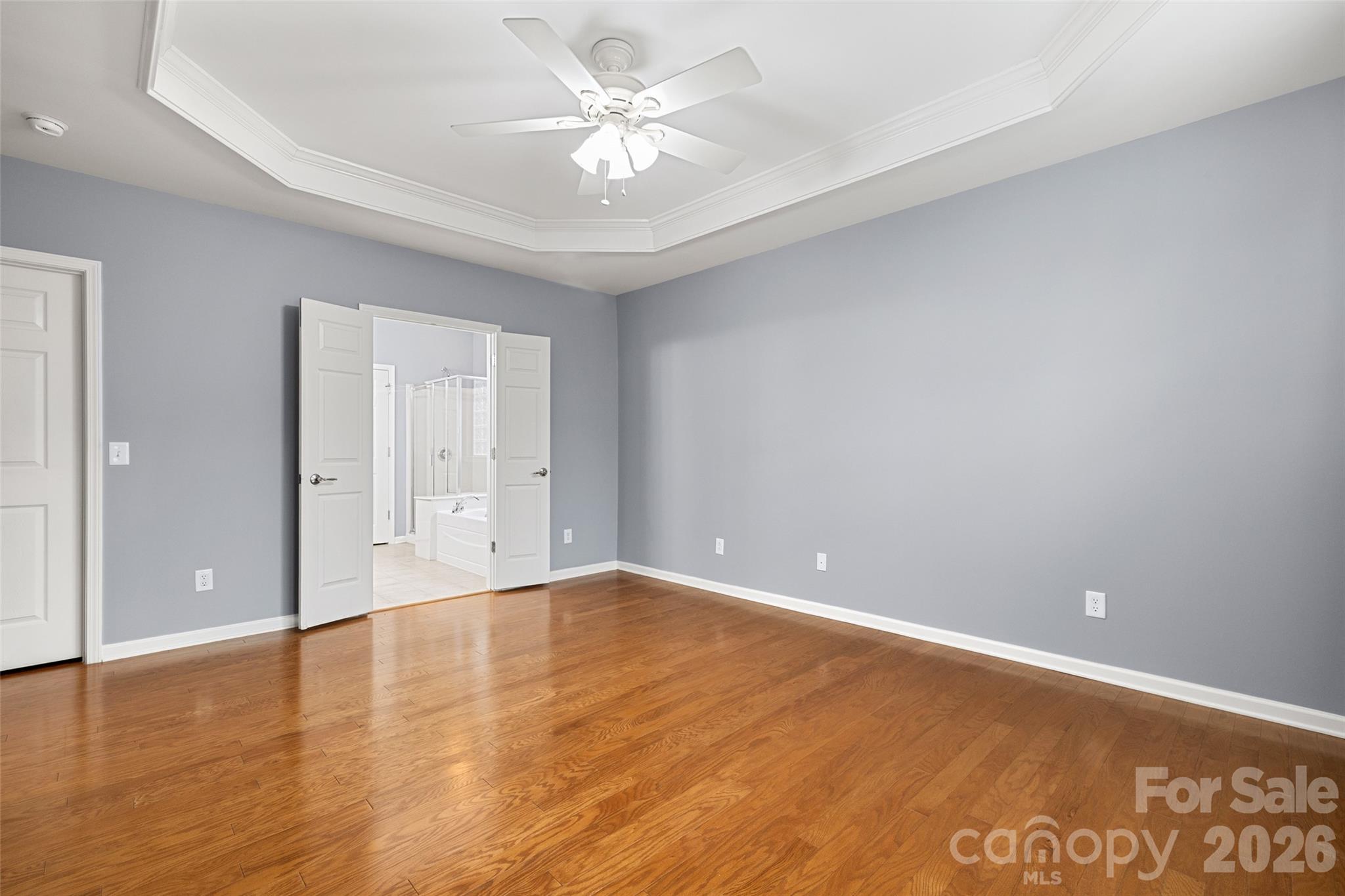 52538 Winchester Street Fort Mill, SC 29707 - Photo 14 of 48 a view of an empty room with window and wooden floor