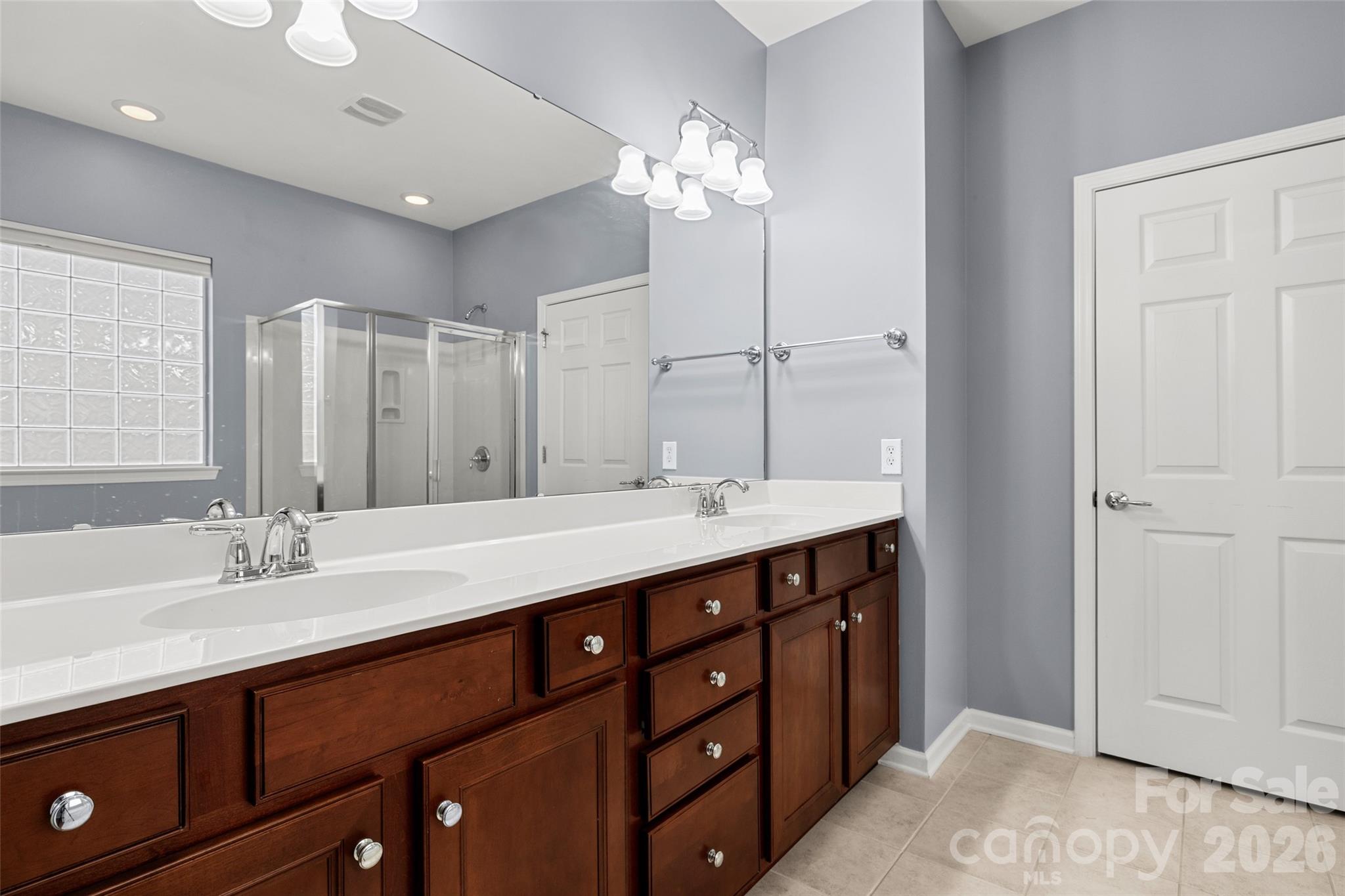 52538 Winchester Street Fort Mill, SC 29707 - Photo 15 of 48 a bathroom with a double vanity sink and a mirror