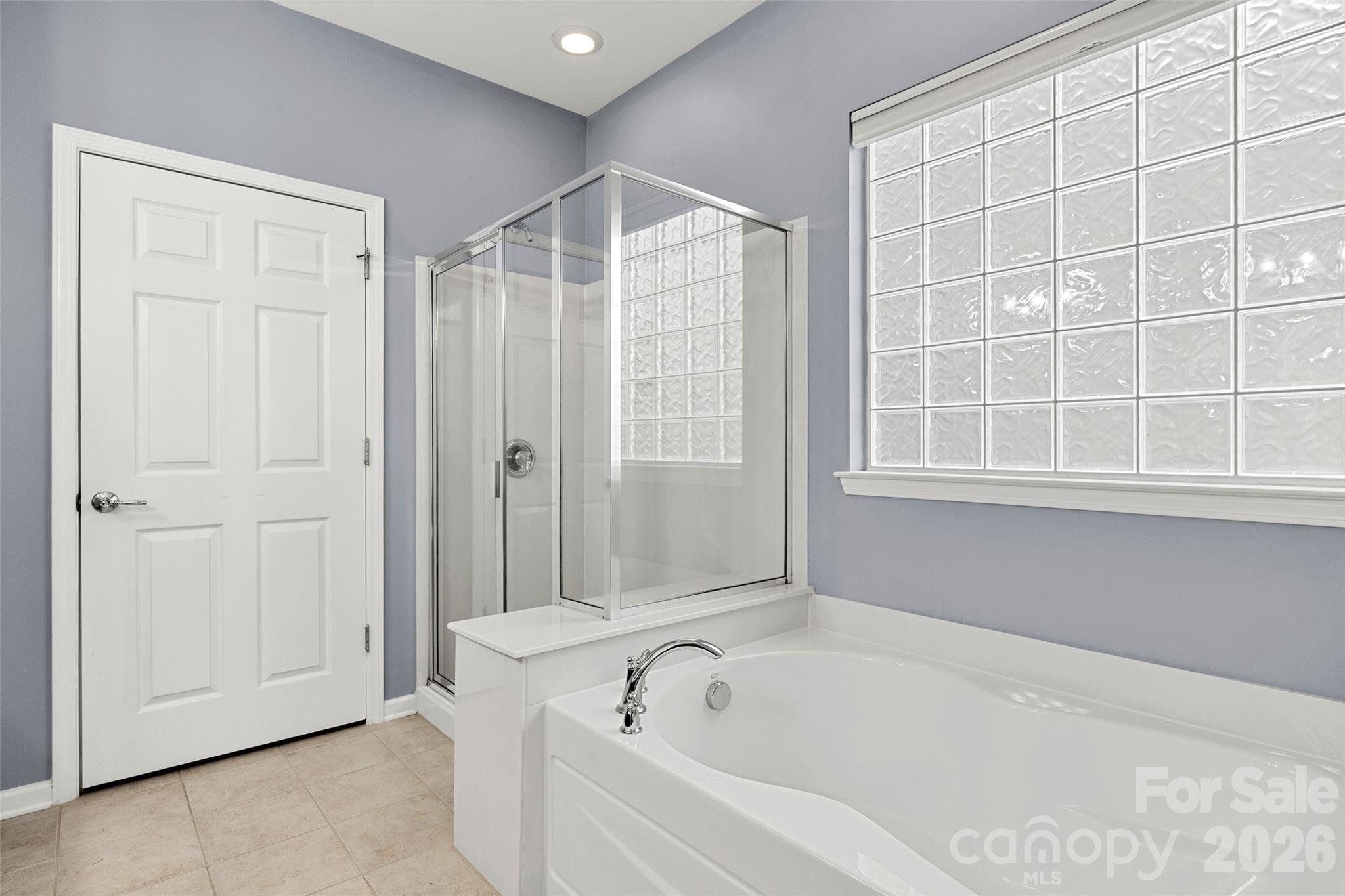 52538 Winchester Street Fort Mill, SC 29707 - Photo 16 of 48 a bathroom with a bathtub and a shower