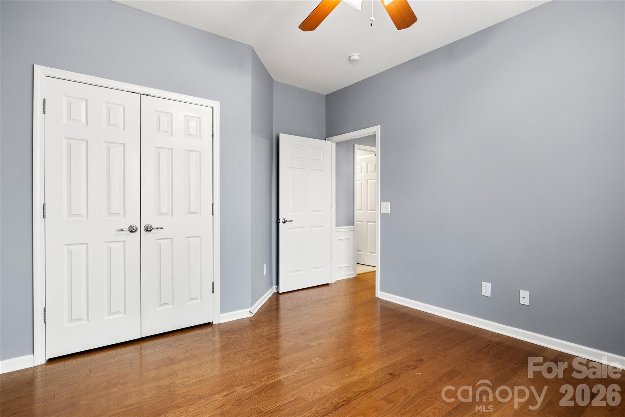 52538 Winchester Street Fort Mill, SC 29707 - Photo 17 of 48 an empty room with wooden floor and closet