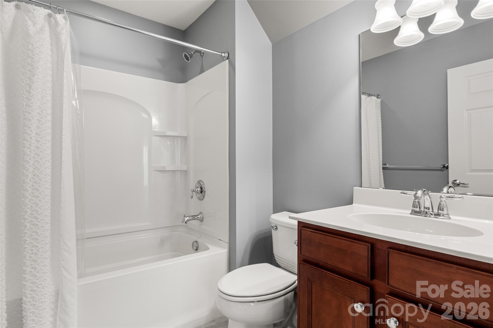 52538 Winchester Street Fort Mill, SC 29707 - Photo 22 of 48 a bathroom with a sink a toilet and shower