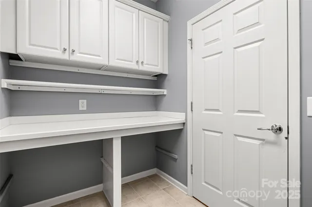 a bathroom with a sink and cabinets