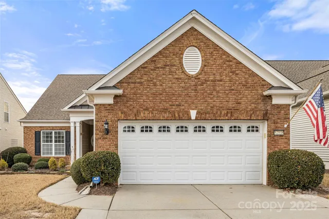 a blue sign that is sitting in front of a house