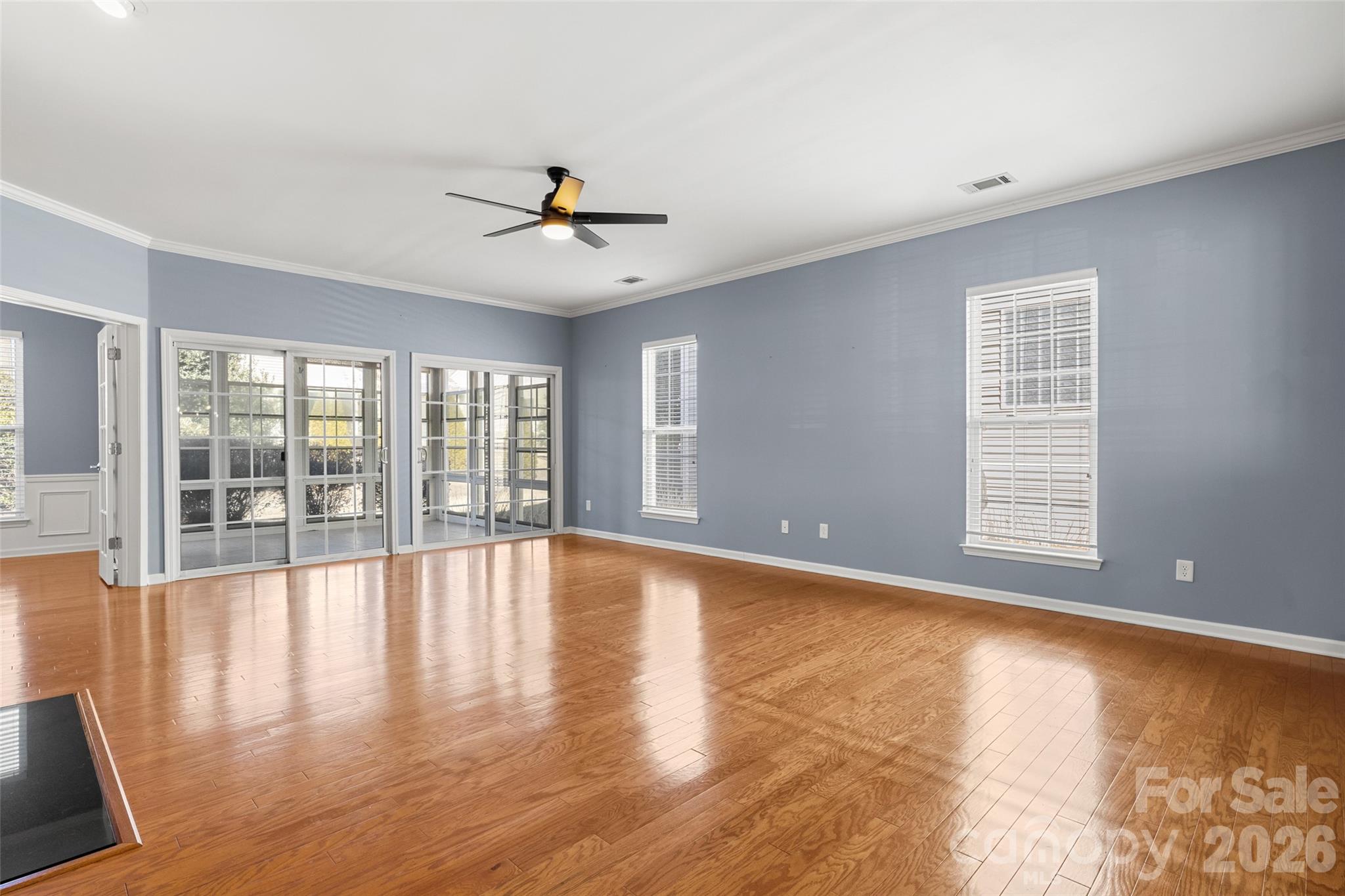 52538 Winchester Street Fort Mill, SC 29707 - Photo 10 of 48 a view of an empty room with wooden floor and a window
