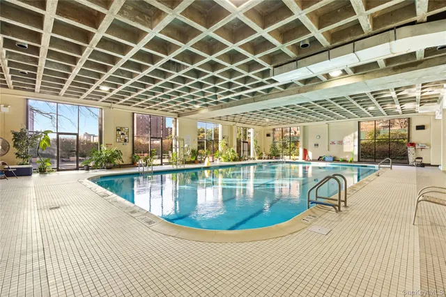 a view of a swimming pool with a patio
