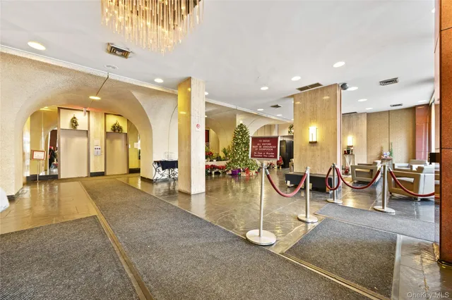 a room with lots of chairs and mirrors