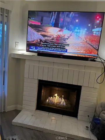 a fireplace with a clock on wall