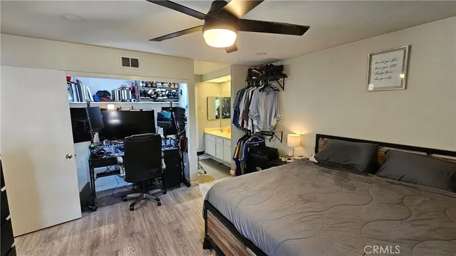 a bedroom with a bed and a walk in closet