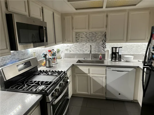 a kitchen with a stove and a microwave