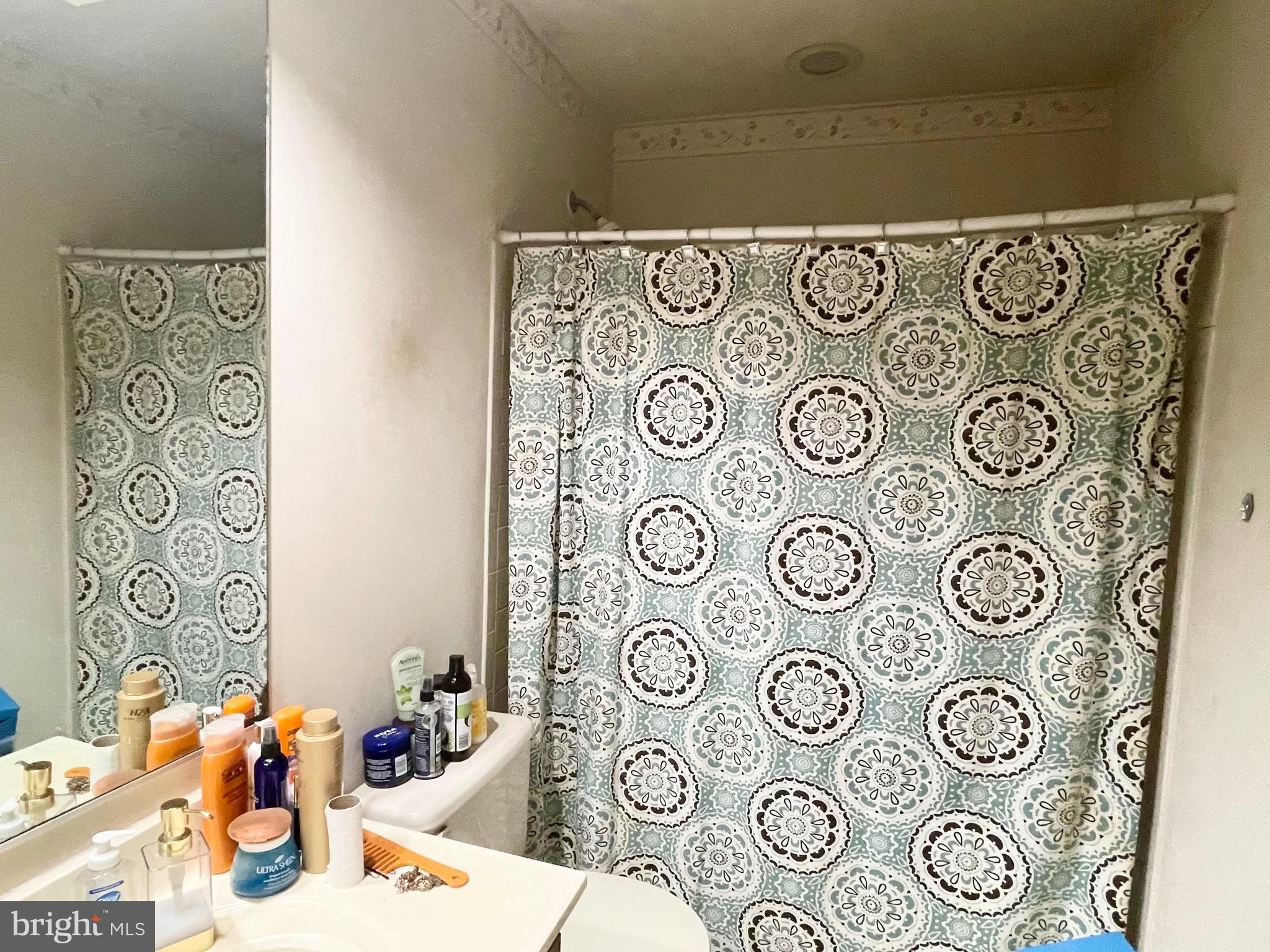 12125 Stoney Bottom Road Germantown, MD 20874 - Photo 14 of 23 a bedroom with a wall and a table