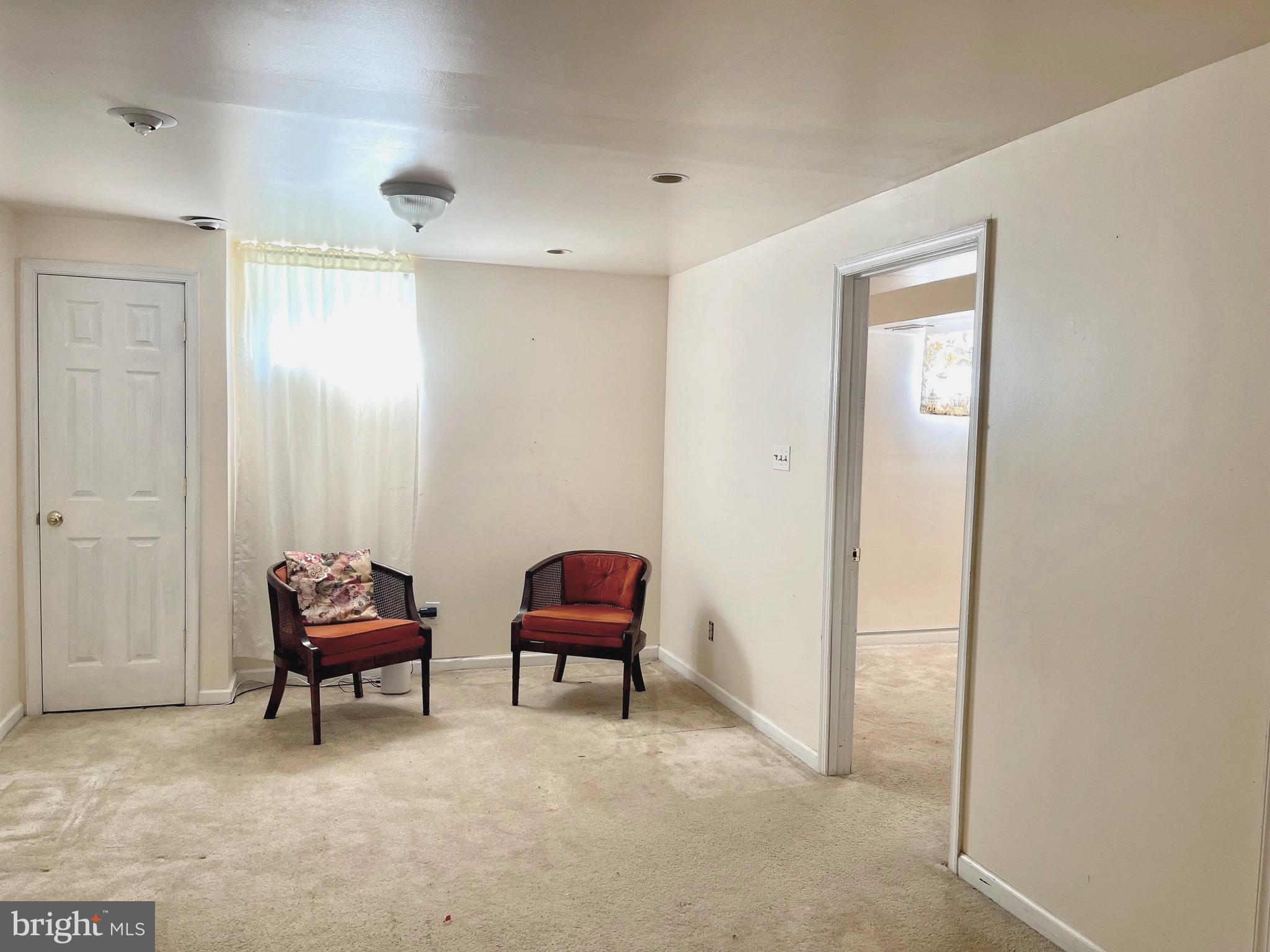 12125 Stoney Bottom Road Germantown, MD 20874 - Photo 16 of 23 a view of a workspace with furniture and a window