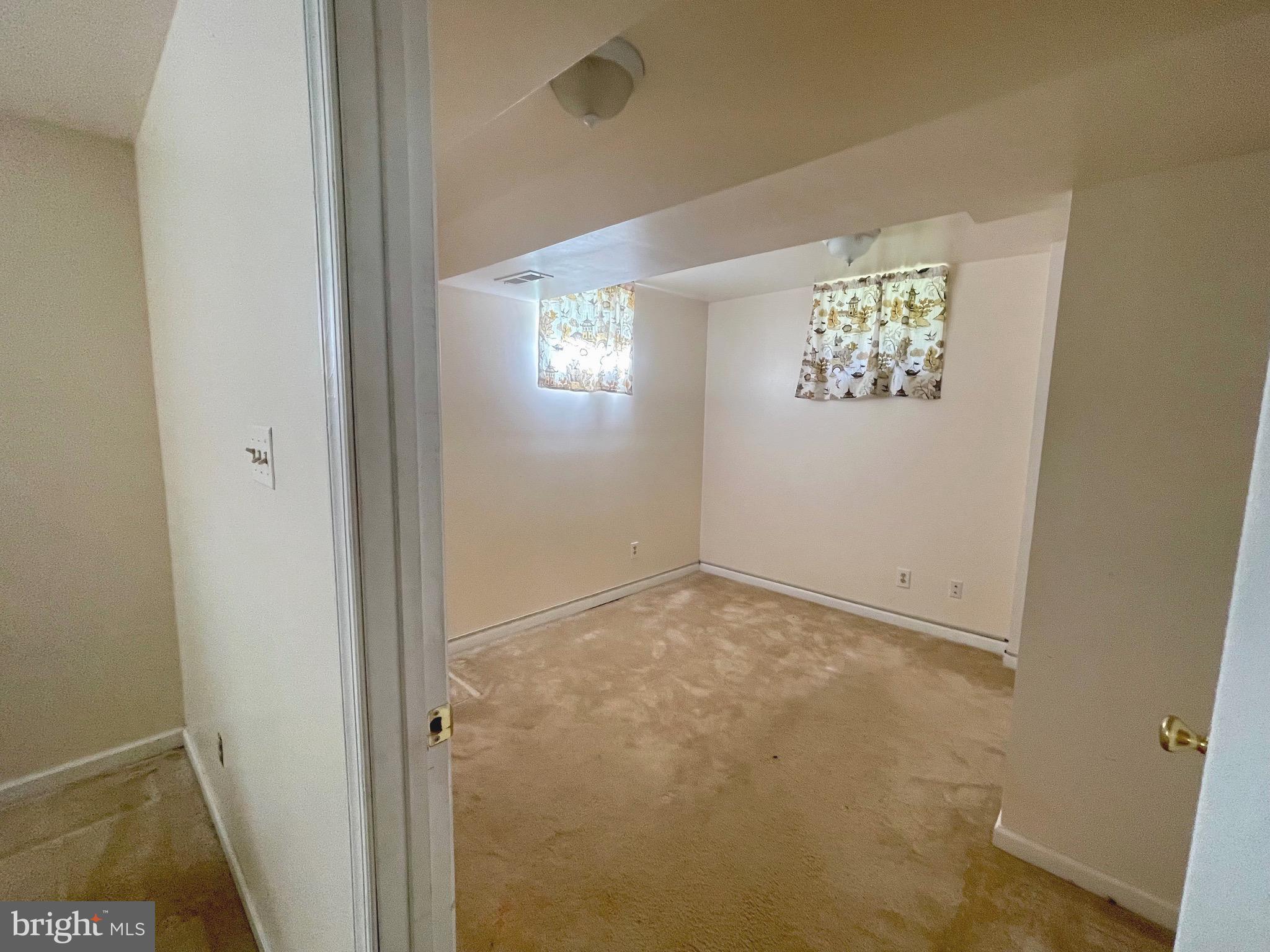 12125 Stoney Bottom Road Germantown, MD 20874 - Photo 18 of 23 an empty room with windows and closet