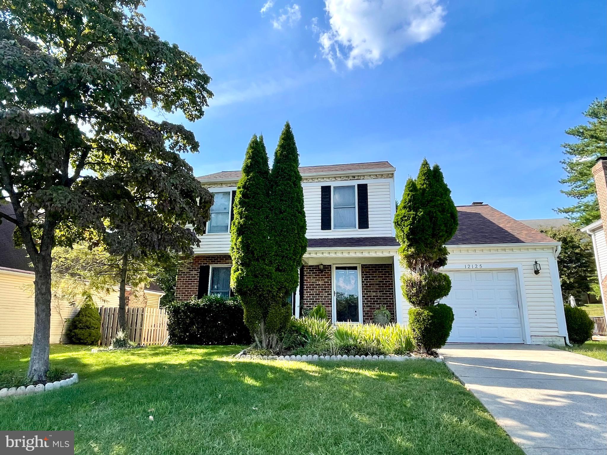 12125 Stoney Bottom Road Germantown, MD 20874 - Photo 2 of 23 front view of a house with a yard