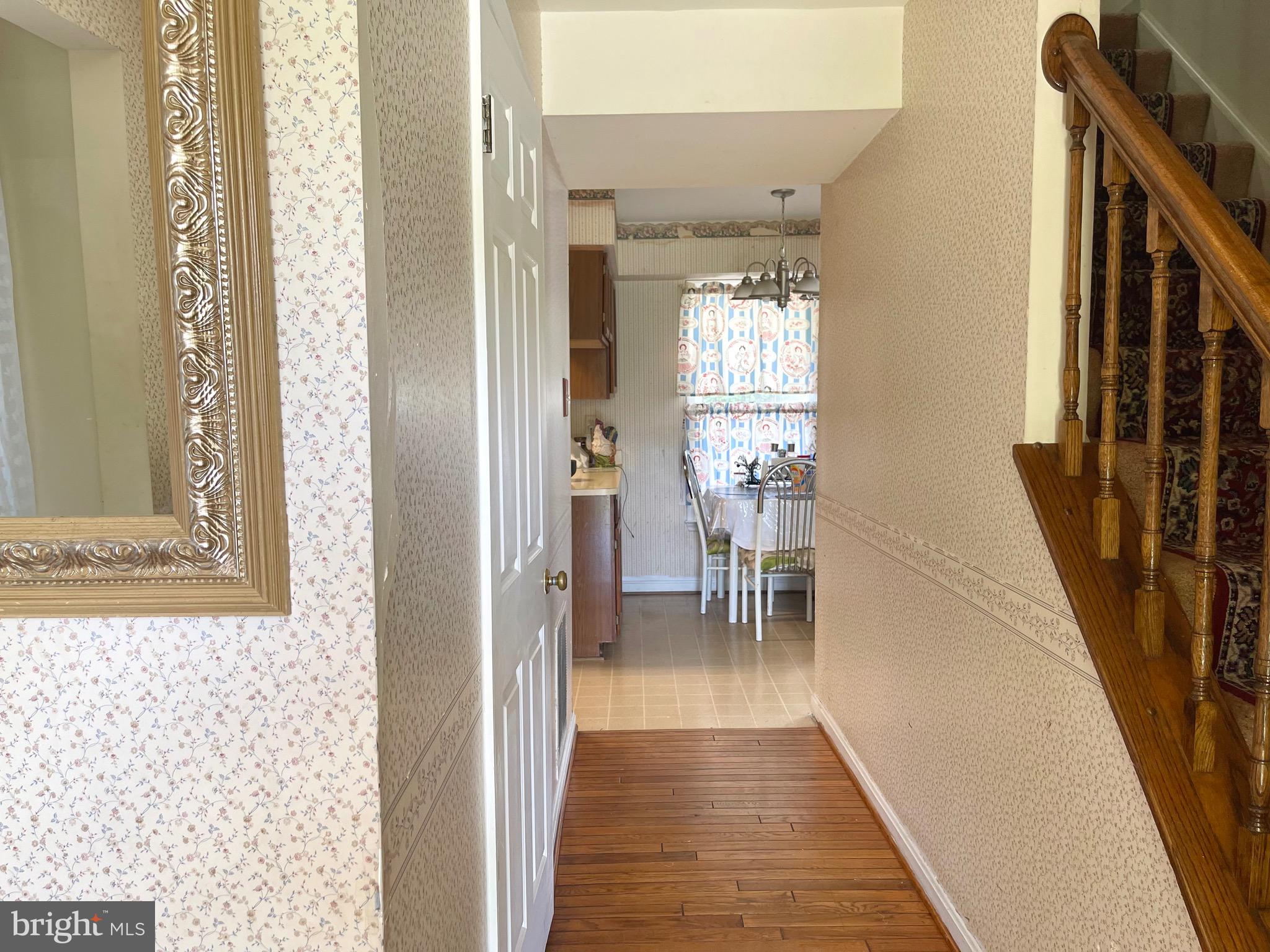 12125 Stoney Bottom Road Germantown, MD 20874 - Photo 4 of 23 a view of a hallway with furniture and a window