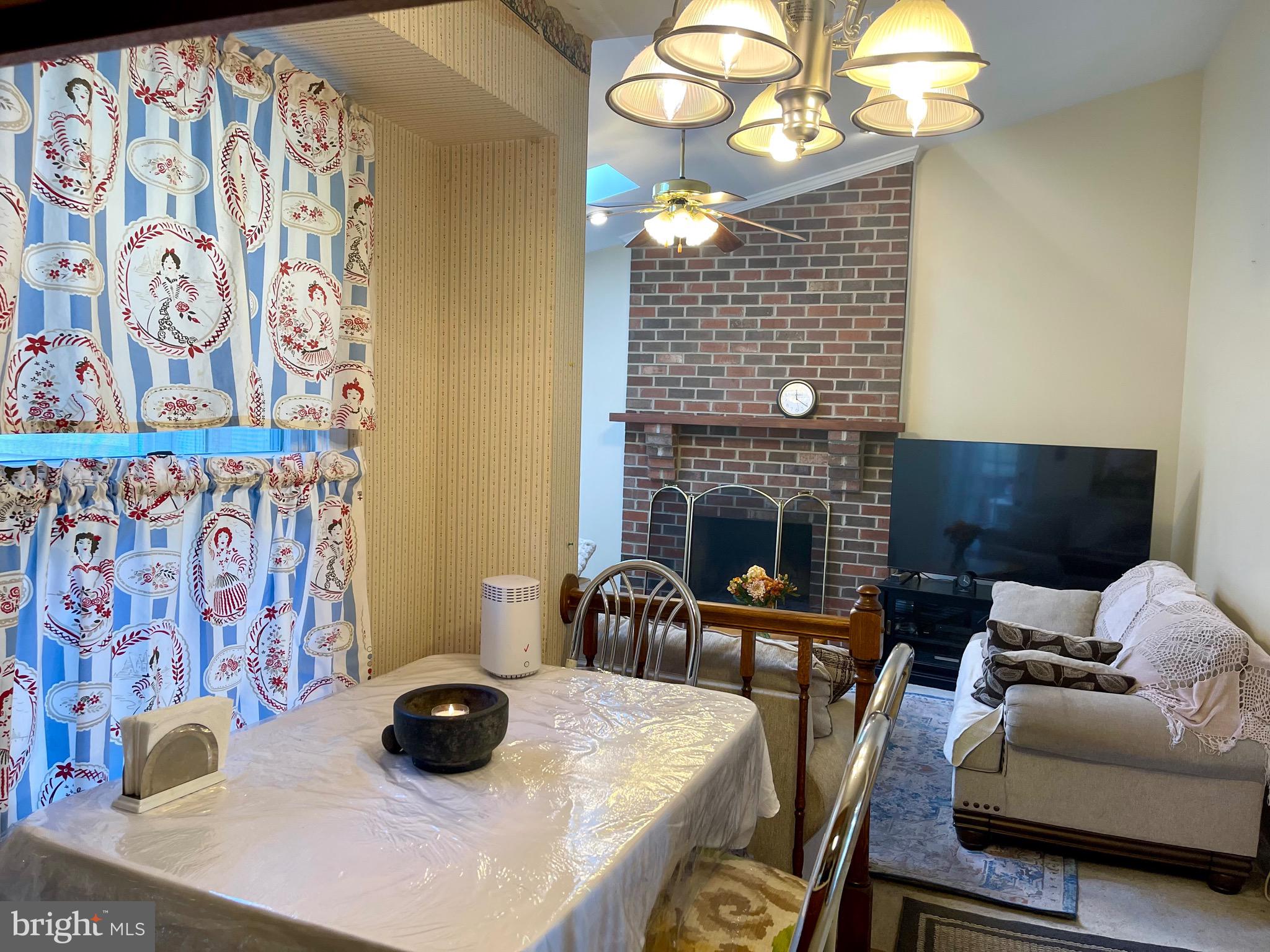 12125 Stoney Bottom Road Germantown, MD 20874 - Photo 8 of 23 a living room with furniture and a fireplace