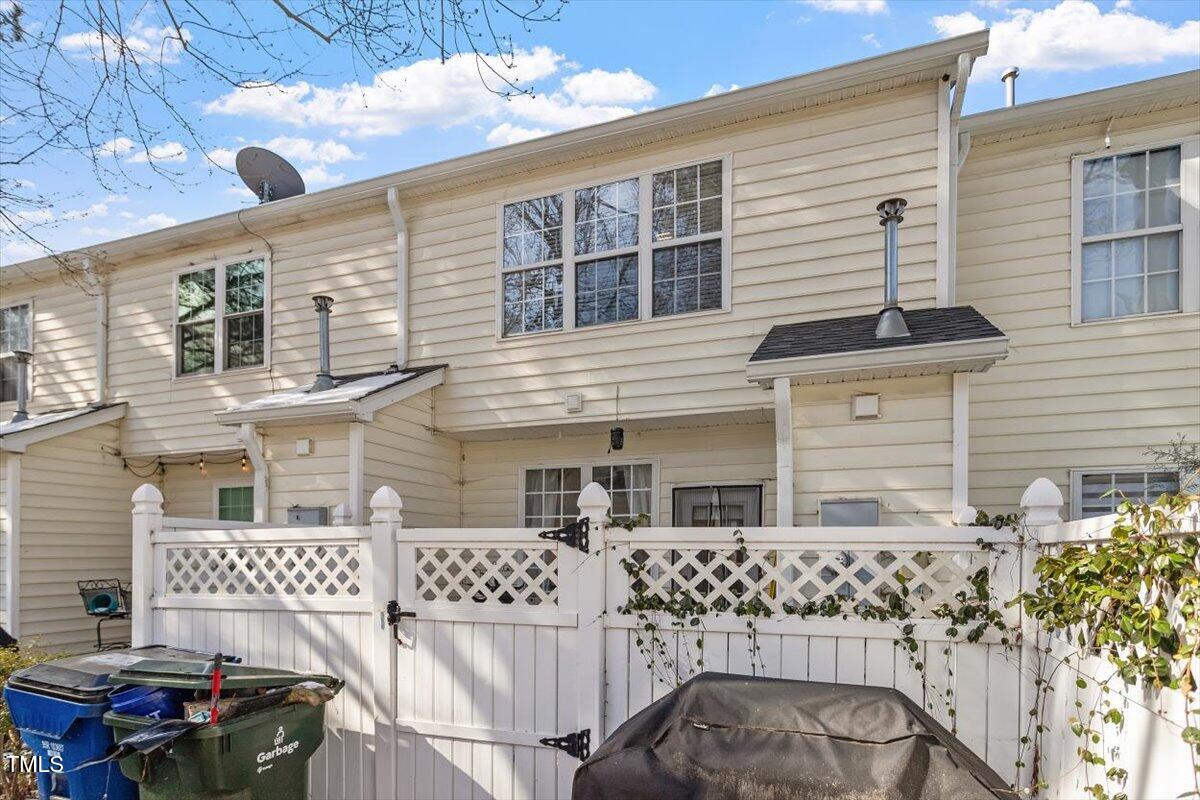5730 Clearbay Lane Raleigh, NC 27612 - Photo 11 of 32 a front view of a house with garage