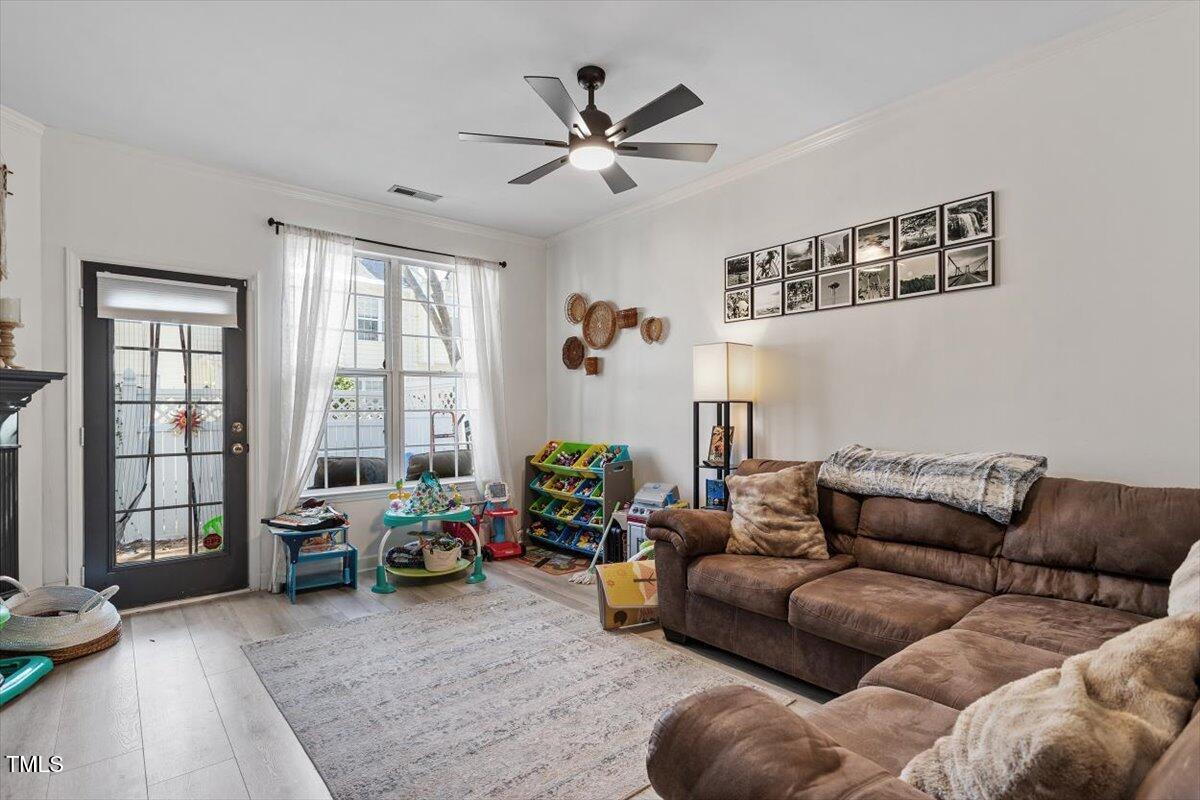 5730 Clearbay Lane Raleigh, NC 27612 - Photo 17 of 32 a living room with furniture and windows