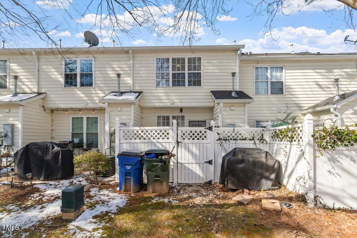 5730 Clearbay Lane Raleigh, NC 27612 - Photo 18 of 32 a front view of a house with garden
