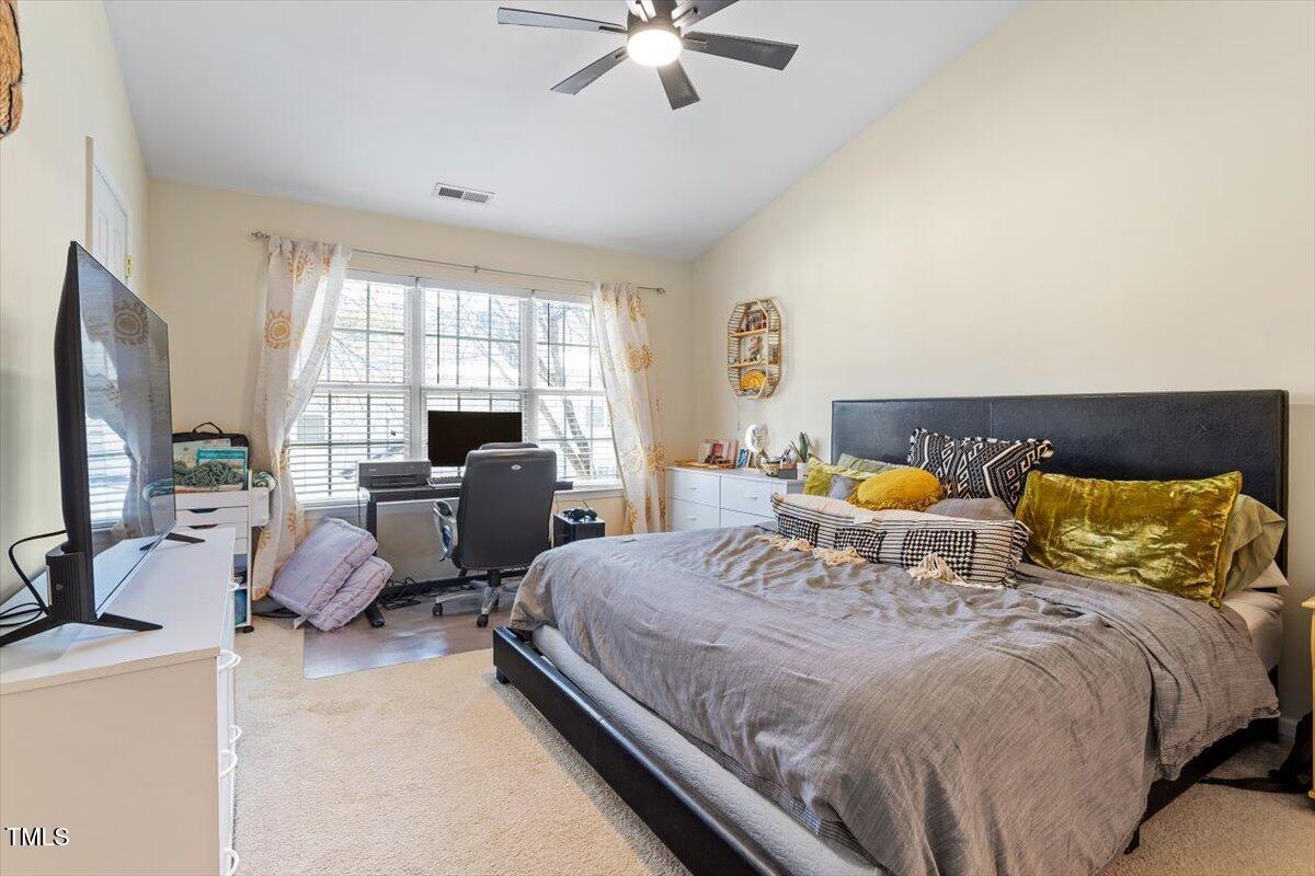 5730 Clearbay Lane Raleigh, NC 27612 - Photo 22 of 32 a bedroom with a bed and window