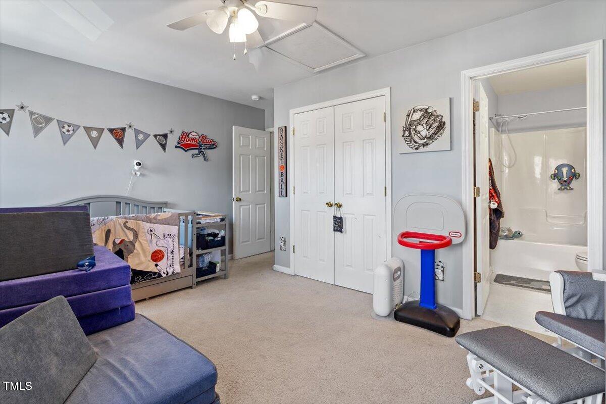 5730 Clearbay Lane Raleigh, NC 27612 - Photo 28 of 32 a children room with toys and a chandelier