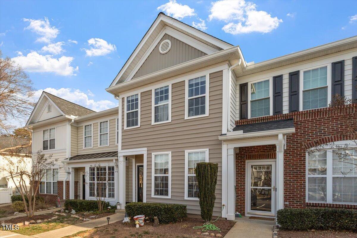 5730 Clearbay Lane Raleigh, NC 27612 - Photo 3 of 32 a front view of a house with a yard