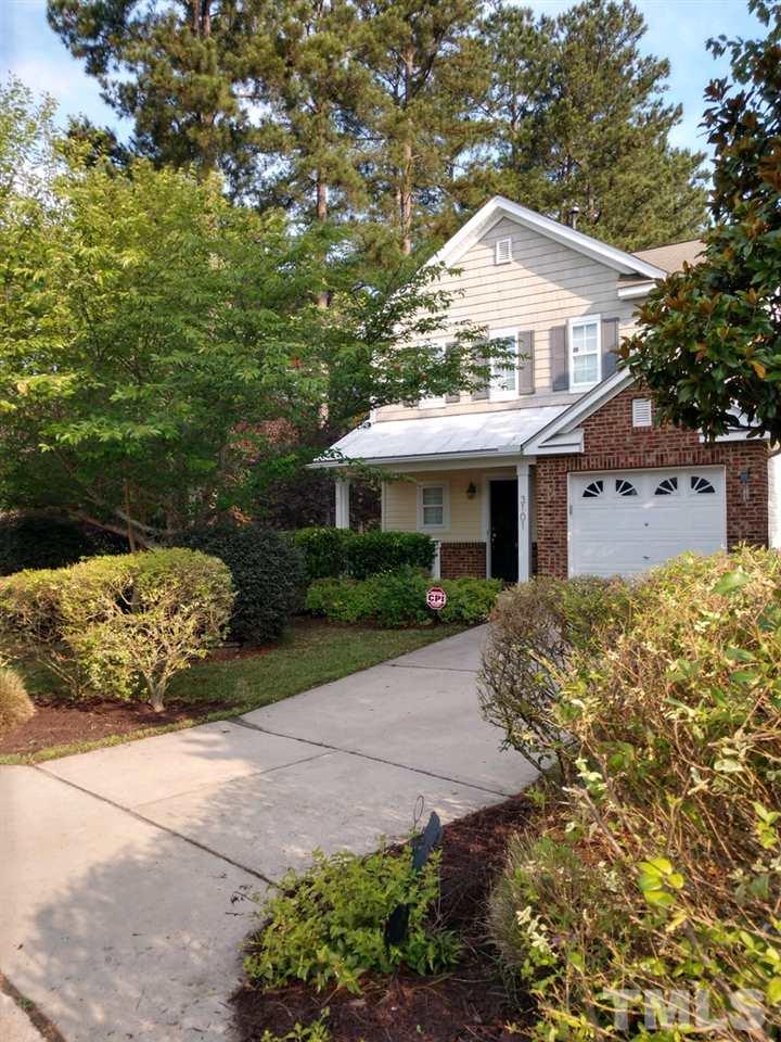 3101 Marcony Way Raleigh, NC 27610 - Photo 2 of 16 a front view of a house with a garden