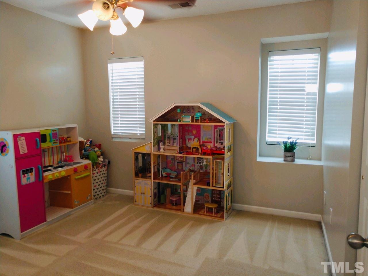 3101 Marcony Way Raleigh, NC 27610 - Photo 11 of 16 a view of a workspace with furniture and chandelier