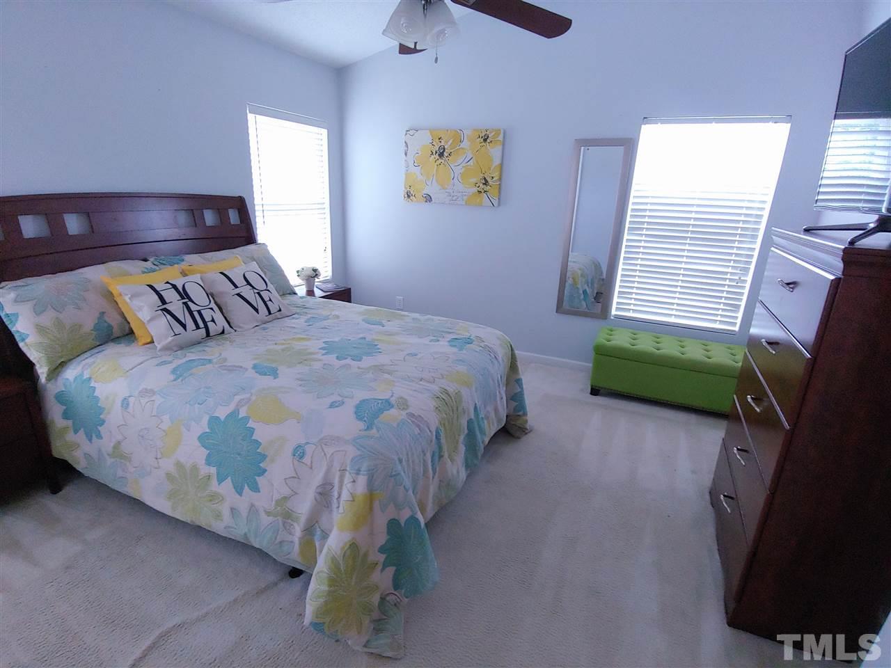 3101 Marcony Way Raleigh, NC 27610 - Photo 13 of 16 a bedroom with a bed and a television
