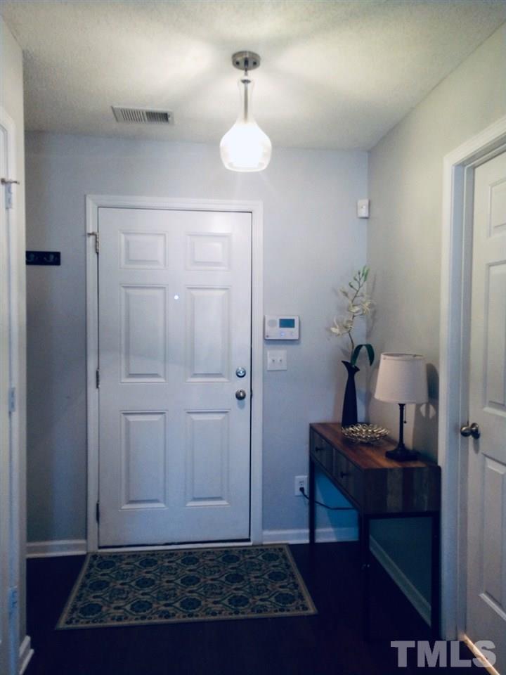 3101 Marcony Way Raleigh, NC 27610 - Photo 5 of 16 a view of room with walk in closet and wooden floor