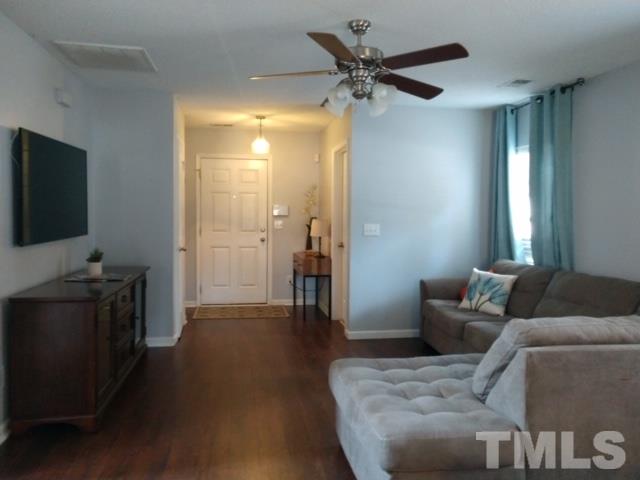 3101 Marcony Way Raleigh, NC 27610 - Photo 6 of 16 a living room with furniture and a flat screen tv