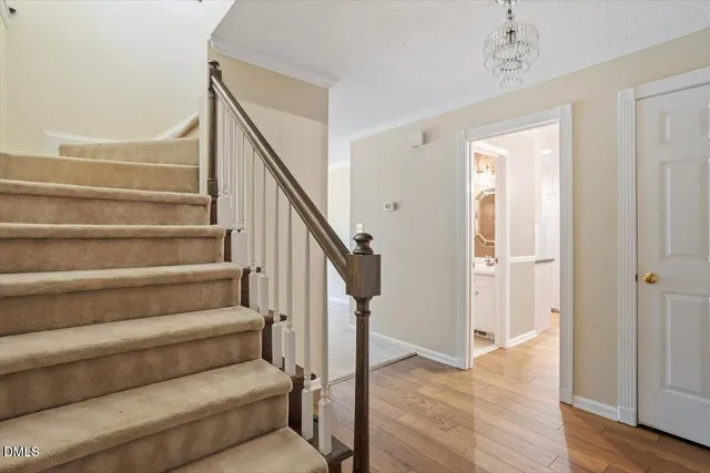 a view of entryway and hall with wooden floor