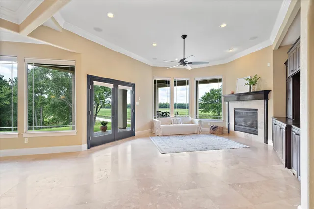 a view of an empty room with window and cabinet