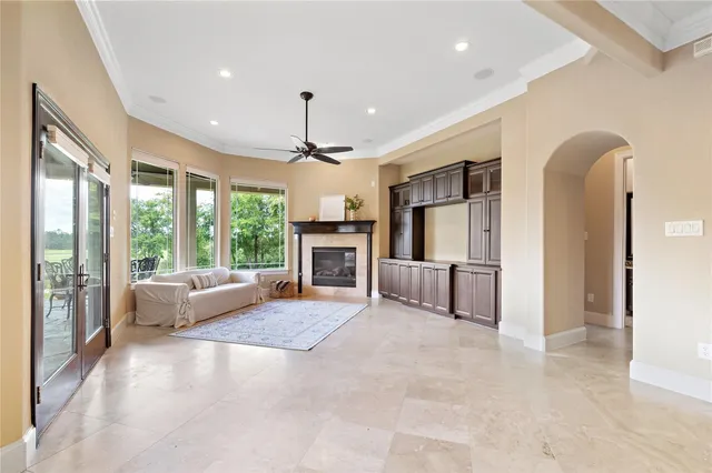 a view of room with window and ceiling fan