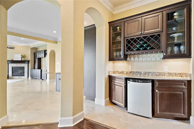a spacious bathroom with a granite countertop sink mirror and a bathtub