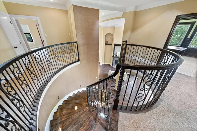 a room with a table chairs and a wooden floor