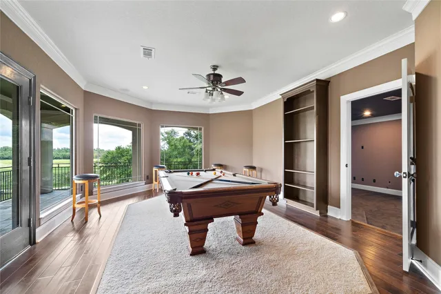 an empty room with a ceiling fan and window