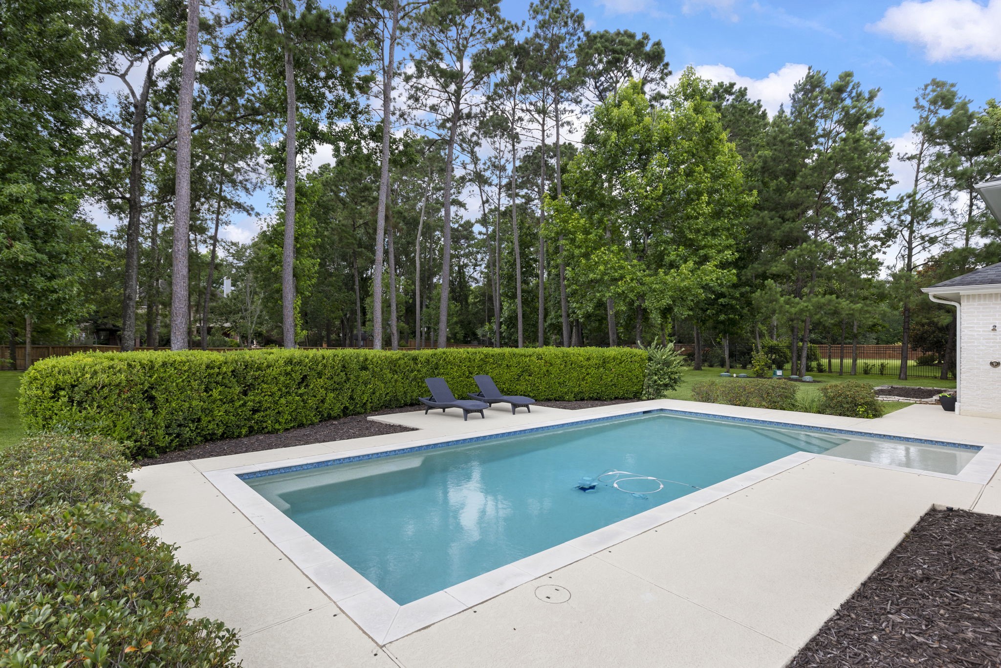 3918 Almond Court Spring, TX 77386 - Photo 31 of 42 a view of a swimming pool with a yard and trees