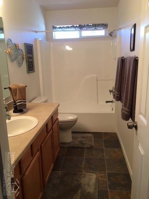 62637 Hawkview Road Bend, OR 97701 - Photo 16 of 19 a bathroom with a sink a toilet and shower