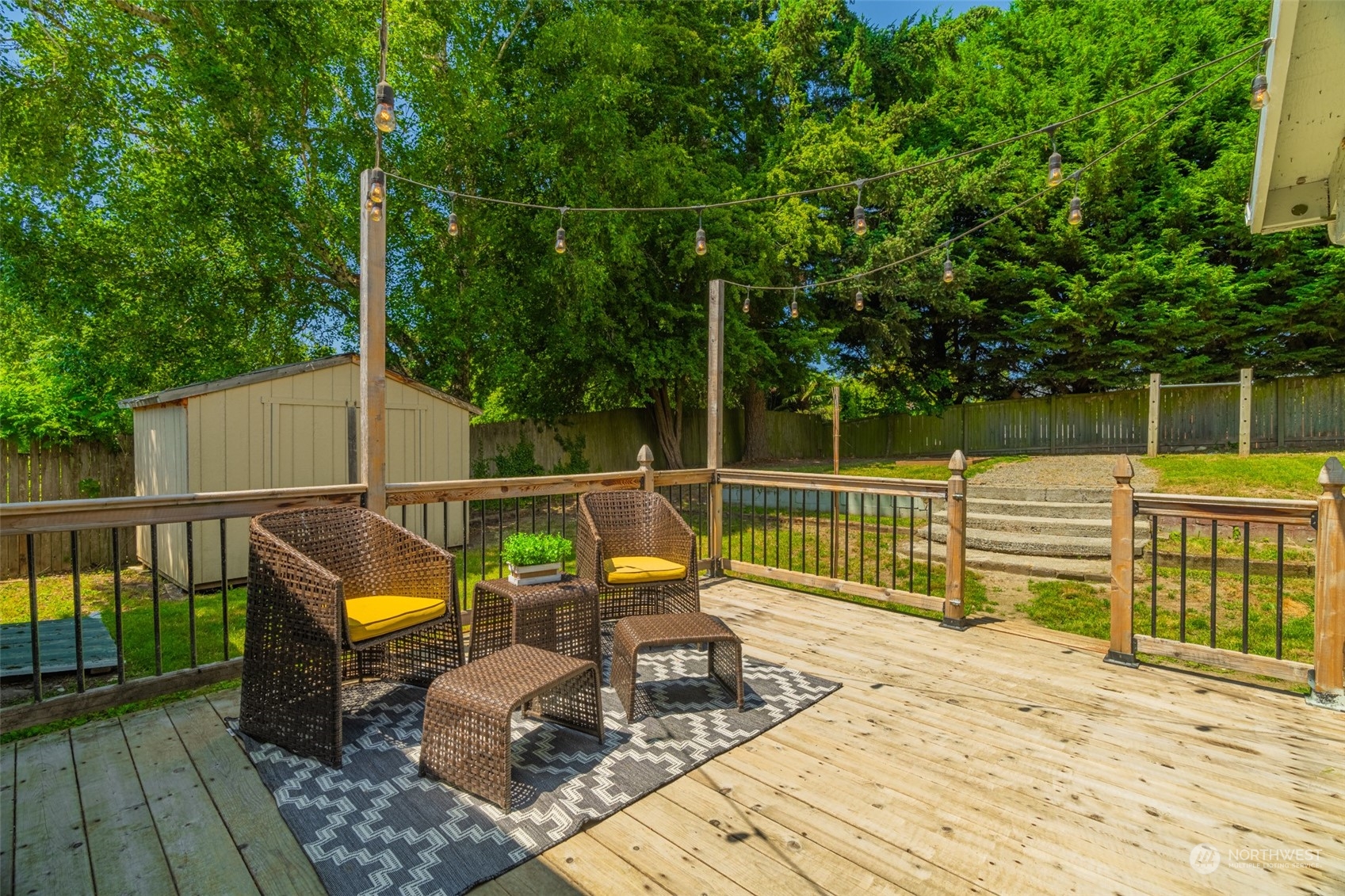 2426 Southwest 328th Street Federal Way, WA 98023 - Photo 12 of 39 a view of a deck with two chair and wooden floor