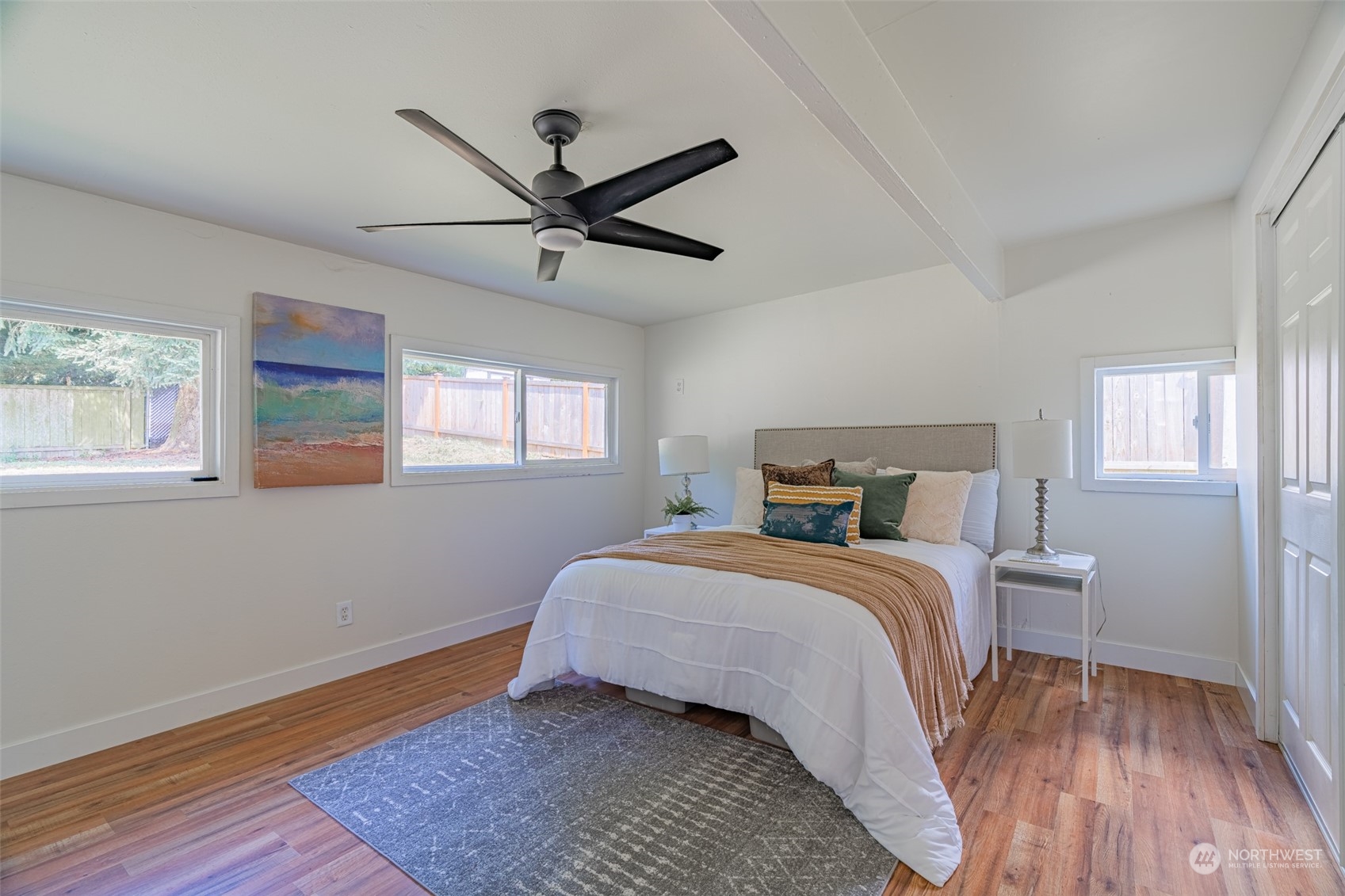 2426 Southwest 328th Street Federal Way, WA 98023 - Photo 13 of 39 a bedroom with a bed and wooden floor