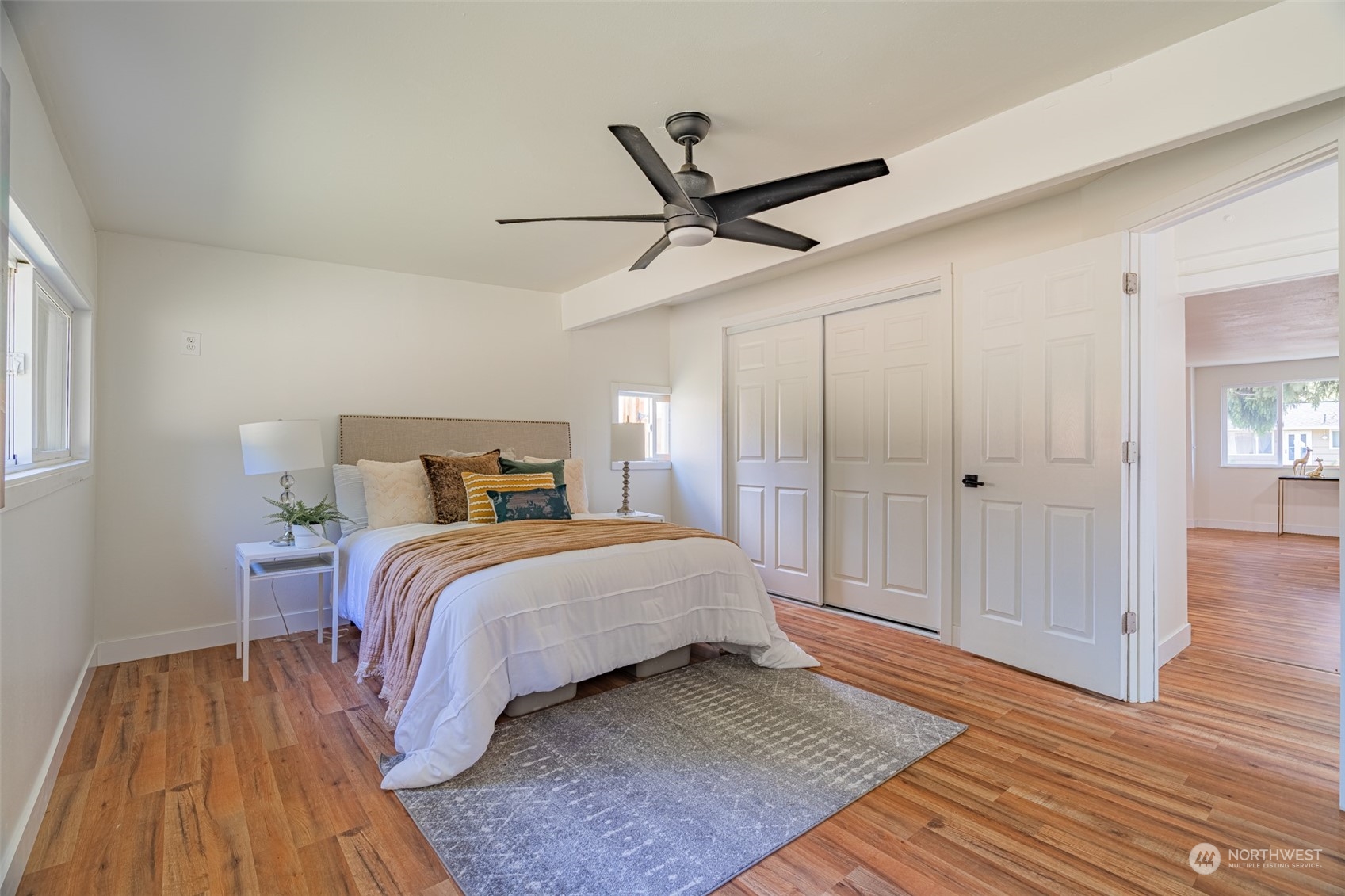 2426 Southwest 328th Street Federal Way, WA 98023 - Photo 14 of 39 a bedroom with a bed and wooden floor