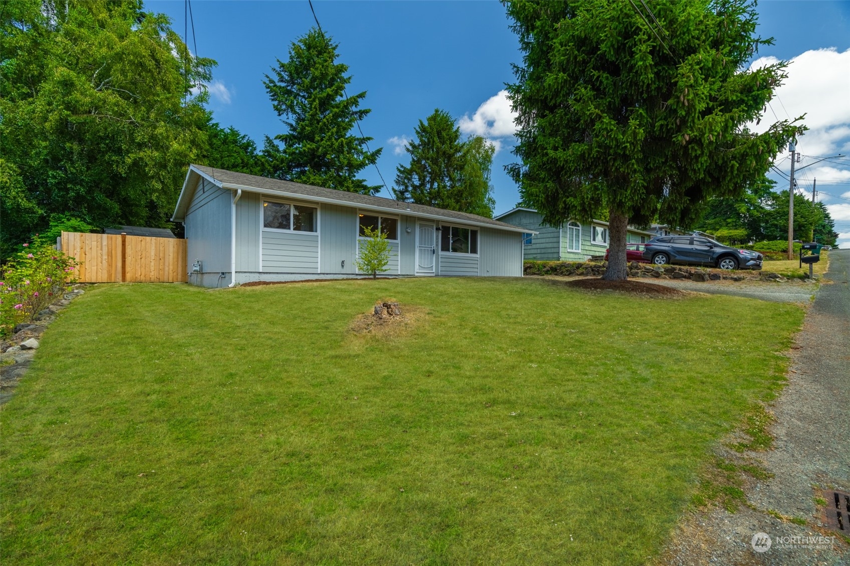 2426 Southwest 328th Street Federal Way, WA 98023 - Photo 2 of 39 a view of a house with a yard and sitting area