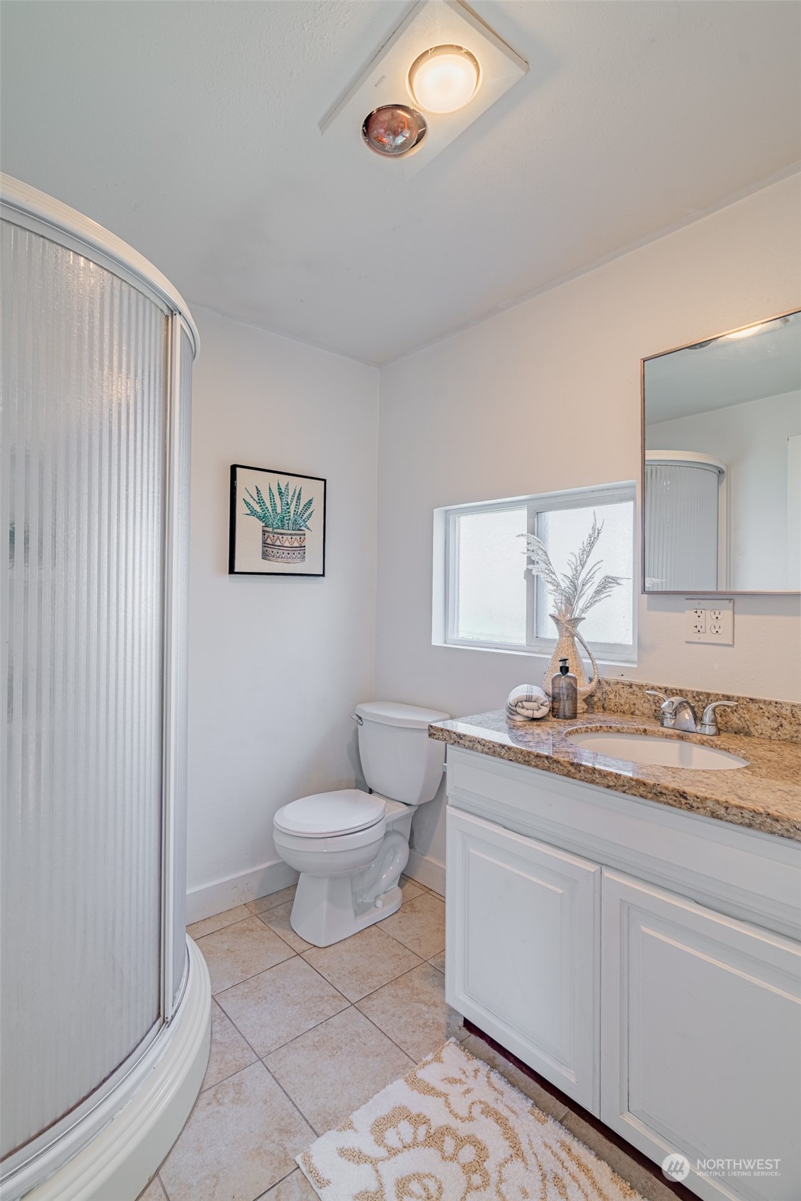 2426 Southwest 328th Street Federal Way, WA 98023 - Photo 27 of 39 a bathroom with a granite countertop toilet a sink and mirror